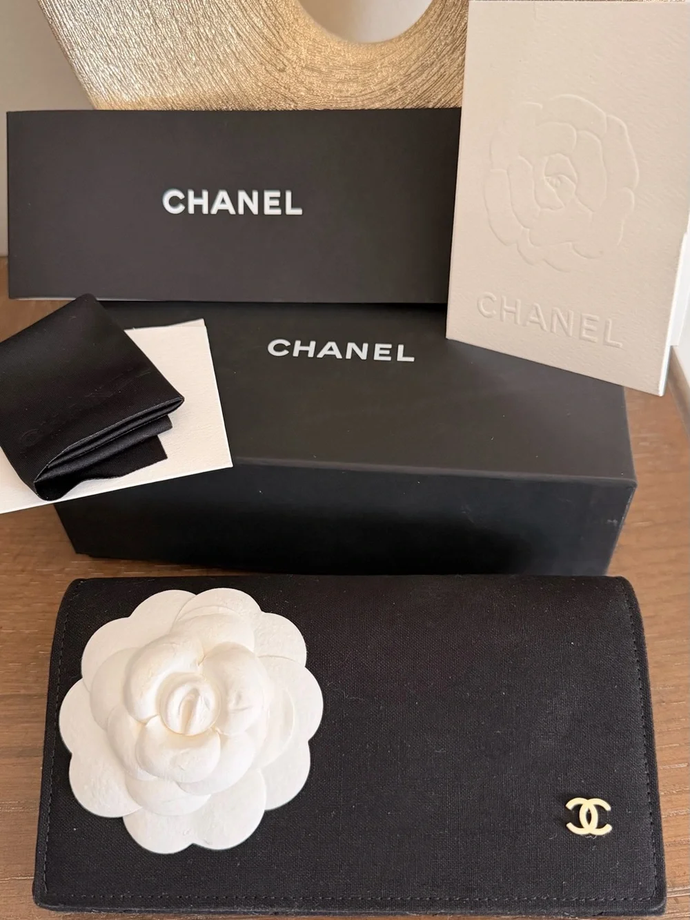 CHANEL Black Cat-Eye Sunglasses with Gold Accent and Gradient Gray Lenses